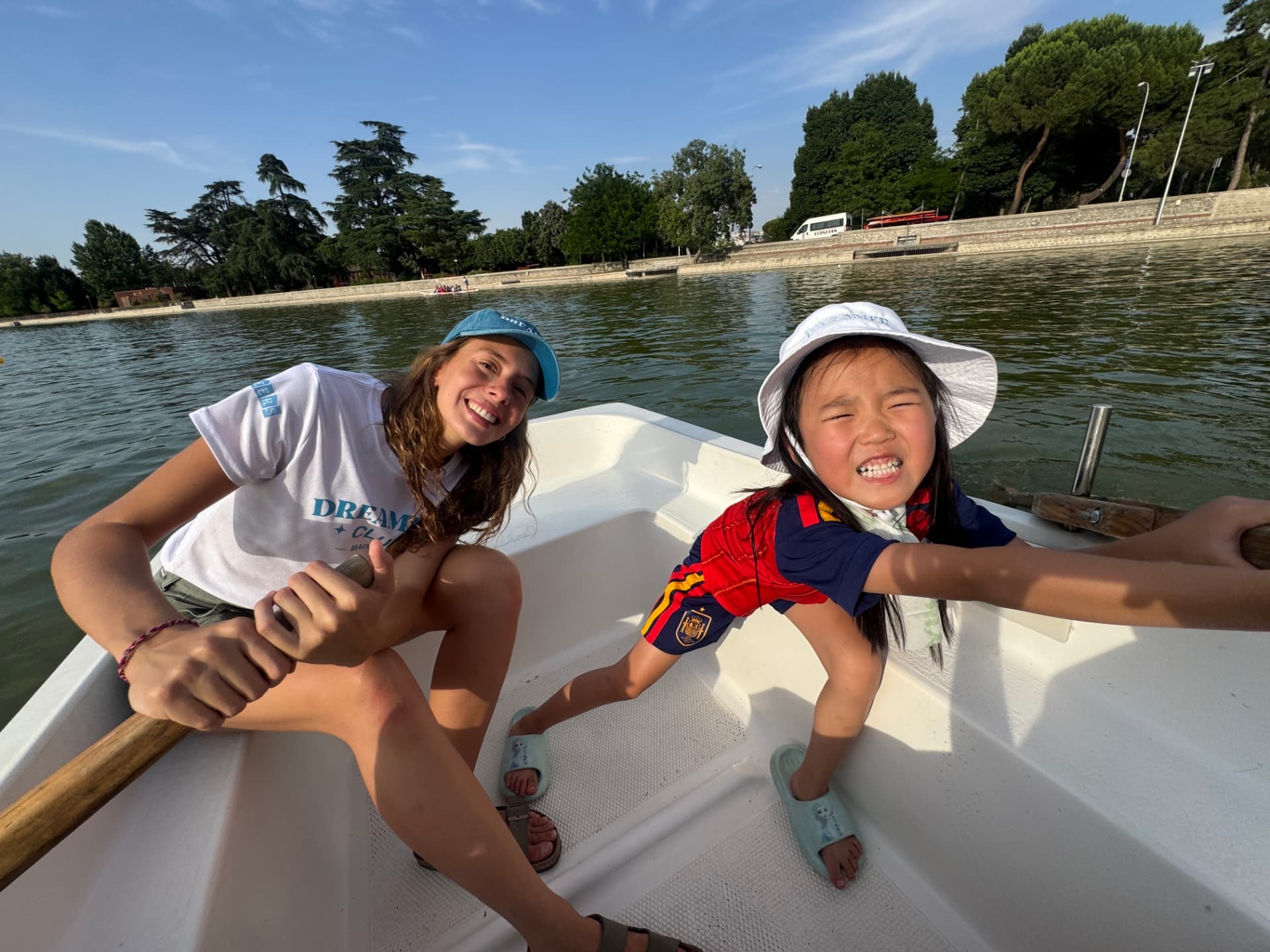 A Dream Leader and a Dreamer rowing together on the Retiro Park lake